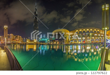 Burj Khalifa and Dubai Fountain at night with reflections in the water 122797622