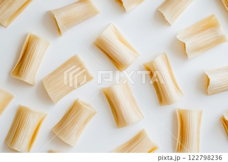 Rigatoni pasta on white surface with top-down view. Neural network AI generated 122798236
