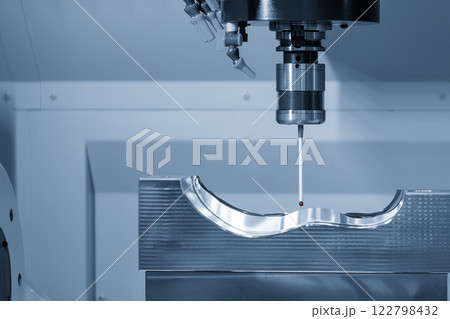 The 3 axis CMM machine measuring the mold parts in the light blue scene. 122798432
