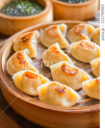 Steamed dumplings with butter served on a plate 122799963