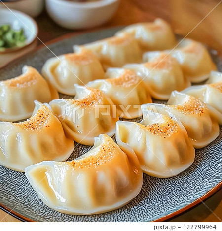 Steamed dumplings with butter served on a plate Steamed dumplings with butter served on a plate 122799964