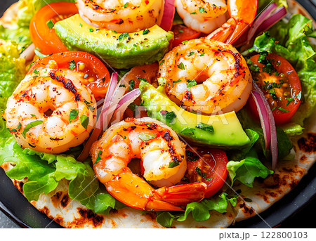 Close up view on burrito with beef, rice, tomatoes, corn and bell pepper in green pita on a brown plate with tomato salsa and guacamole. Vegetarian Shawarma Roll Close up view on burrito with beef, rice, tomatoes, corn and bell pepper in green pita on a brown plate with tomato salsa and guacamole. Vegetarian Shawarma Roll 122800103