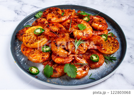 grilled shrimp, unpeeled, headless, with spices, on a marble table, homemade, no people, 122803068