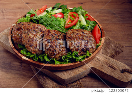 Fried cutlets, mixed minced meat, with vegetable salad, homemade, top view, no people, Fried cutlets, mixed minced meat, with vegetable salad, homemade, top view, no people, 122803075