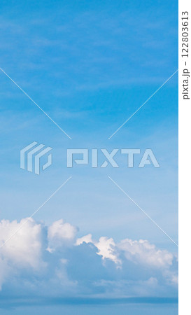 VERTICAL Atmosphere panorama real photo beautiful summer white cloud clear blue sky line calm. Concept paradise life. Design relax wallpaper background. More tone format in stock, fantasy collection 122803613