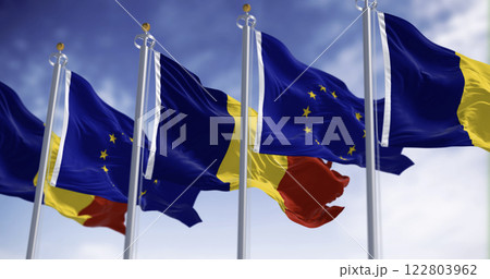 Romania and European Union flags waving in the wind on a clear day 122803962