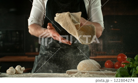 Freeze Motion of Chef Making Yeast Dough . Closeup of Bread or Pizza Dough Preparation Freeze Motion of Chef Making Yeast Dough . Closeup of Bread or Pizza Dough Preparation 122804274