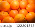 Fresh oranges beautifully lit on counter, close-up of vibrant citrus fruits with healthy nutrition concept perfect for food photography, summer fruit, organic, vitamin c rich, bright citrus freshness 122804842