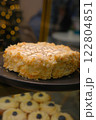 Beautiful black white hazelnut esterhazy cake topped almond slices on black plate on countertop elegant gourmet dessert rich layers flavor luxury pastry sweet indulgence sophisticated confection 122804851
