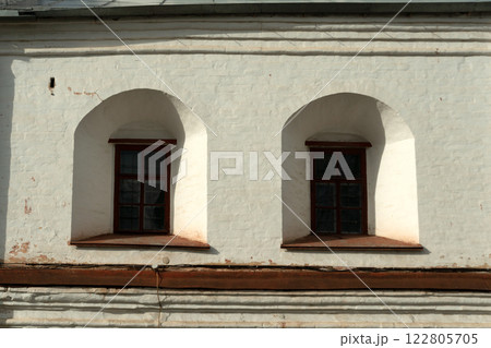 Vologda Kremlin. Small windows in the ancient walls of the Kremlin. Medieval fortifications. Vologda Kremlin. Small windows in the ancient walls of the Kremlin. Medieval fortifications. 122805705