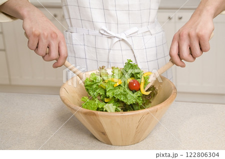 Person Mixing Salad, Close View Background, Food Photography 122806304