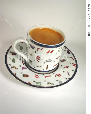 A cup of coffee on a table close view background A cup of coffee on a table close view background 122806376