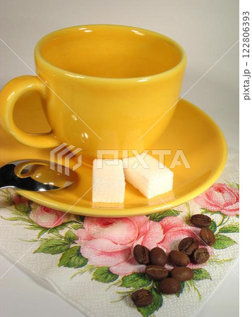 A cup of coffee on a table close view background 122806393
