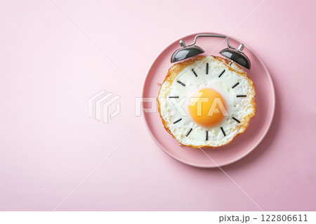 fried eggs in the form of an alarm clock, morning concept 122806611