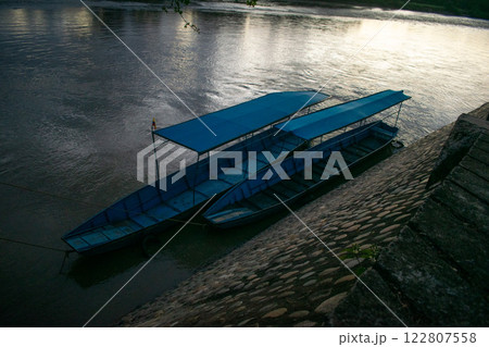 Canoe Moored on a Riverbank Canoe Moored on a Riverbank 122807558
