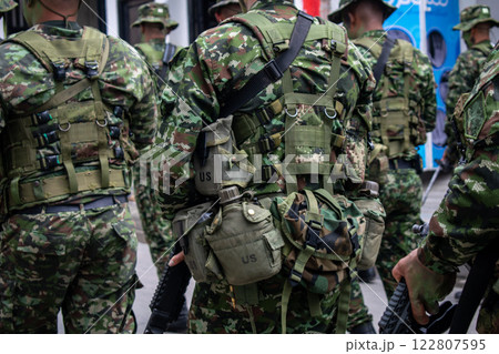 Colombian army patrolling the streets, military forces on urban patrol in Colombia, soldiers securing the streets in Colombia, army troops conducting street patrol, Colombian military presence in 122807595