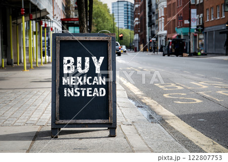 BUY MEXICAN INSTEAD. Foldable advertising poster on the street BUY MEXICAN INSTEAD. Foldable advertising poster on the street 122807753
