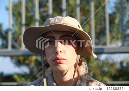 Tired And Sad Woman Soldier Resting Tired And Sad Woman Soldier Resting 122808224