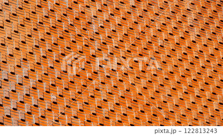 a textured brick wall with an intricate, repetitive pattern of protruding bricks. The arrangement creates dynamic shadows, adding depth and dimension to the facade. a textured brick wall with an intricate, repetitive pattern of protruding bricks. The arrangement creates dynamic shadows, adding depth and dimension to the facade. 122813243