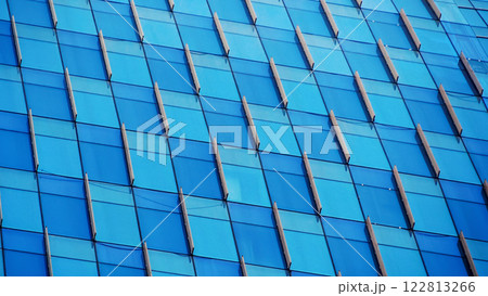 Dynamic Modern Facade - Blue glass panels with bold diagonal accents, ideal for architectural showcases, futuristic branding, or creative urban design projects 122813266