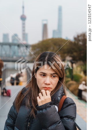 woman traveler visiting in Shanghai, China. Happy Female Tourist sightseeing Oriental Pearl Tower and Waibaidu Bridge view. landmark and popular for tourism attractions. Travel and vacation concept woman traveler visiting in Shanghai, China. Happy Female Tourist sightseeing Oriental Pearl Tower and Waibaidu Bridge view. landmark and popular for tourism attractions. Travel and vacation concept 122814547