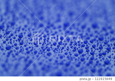 Closeup waterdrops on blue ceramic coated paint surface Closeup waterdrops on blue ceramic coated paint surface 122815649