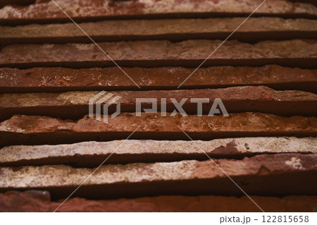 closeup stacked old brick cut tiles 122815658
