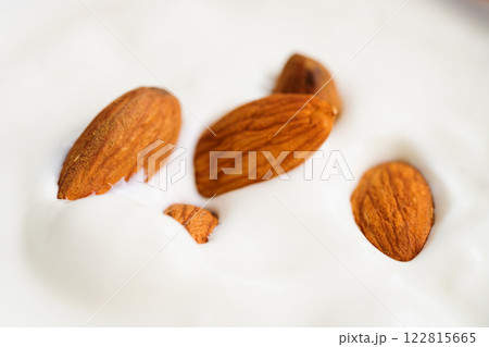 Yogurt with almonds closeup shot Yogurt with almonds closeup shot 122815665