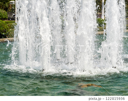 Majestic water fountain display urban park serene environment close-up view nature's beauty Majestic water fountain display urban park serene environment close-up view nature's beauty 122815936