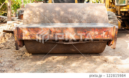 Construction equipment roller machine at work job site industrial environment ground level view 122815984