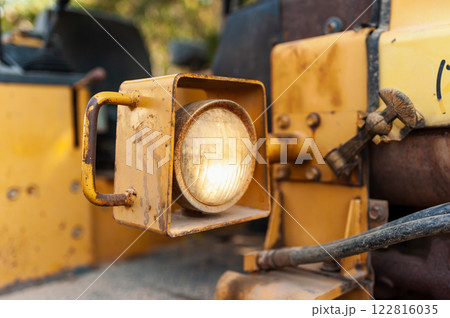 Industrial action close-up of construction machinery in urban setting Industrial action close-up of construction machinery in urban setting 122816035