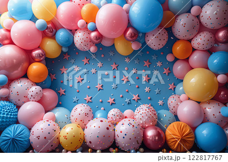 Colorful balloon wall with stars and blue background. Festive birthday and lively atmosphere 122817767