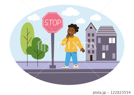 Cute vector illustration of child standing on sidewalk and looking at stop sign in urban setting. Little boy curious about road safety, learning signs. Buildings, trees doodles in flat cartoon style 122823554