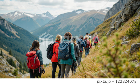 Group of hikers on mountain trail overlooking lake adventure travel nature scenic view summer exploration outdoor activity friends journey Group of hikers on mountain trail overlooking lake adventure travel nature scenic view summer exploration outdoor activity friends journey 122824078