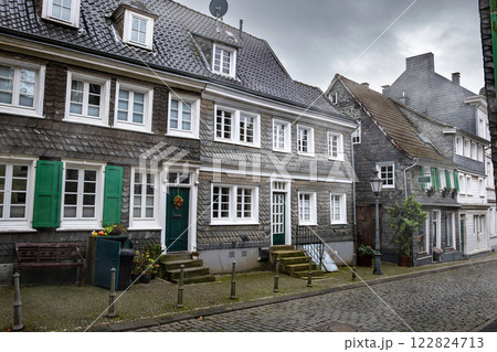 Slate houses in beautiful sightseeing of Solingen Greaufrath in Germany, haze autumn morning 122824713