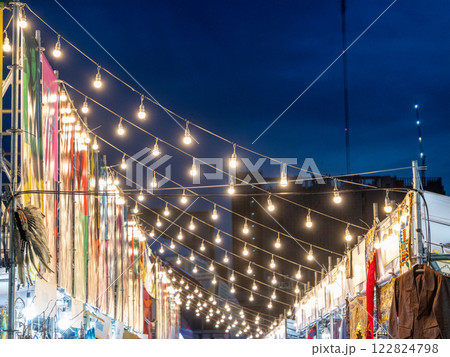 Festive night market stroll urban city evening ambiance wide angle cultural experience 122824798