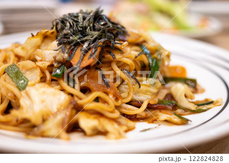 Delicious noodles with seaweed asian restaurant food cozy setting close-up culinary delight 122824828