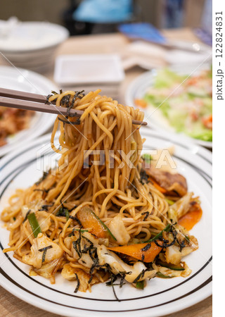 Delicious noodle dish restaurant food casual dining close-up culinary delight Delicious noodle dish restaurant food casual dining close-up culinary delight 122824831