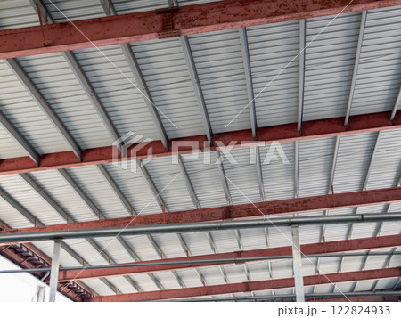 Industrial architecture steel beams and structure warehouse interior urban environment upward view 122824933