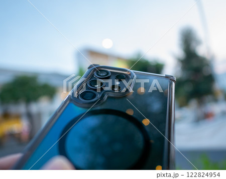Capturing the future smartphone showcase urban setting evening close-up technology insights 122824954