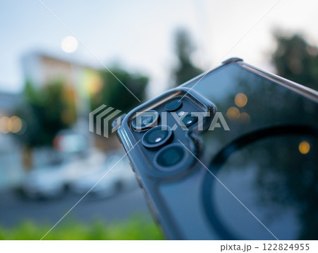 Capturing technology smartphone close-up in urban setting nature background 122824955