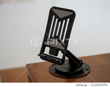 Close-up photography of innovative smartphone holder a functional home office essential Close-up photography of innovative smartphone holder a functional home office essential 122825079