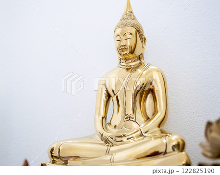 Golden buddha statue serene temple art display tranquil environment close-up cultural significance Golden buddha statue serene temple art display tranquil environment close-up cultural significance 122825190
