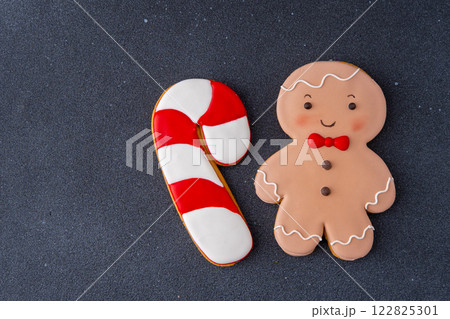 Gingerbread man cane copy space winter sweet food background. Christmas cookies. 122825301