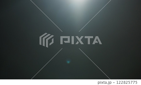 Real optic lens flare over black background for overlay or background 122825775