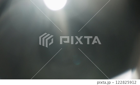 Real lens flare from optics with bokeh and obstruction on foreground Real lens flare from optics with bokeh and obstruction on foreground 122825912