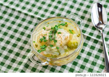 Diet chicken soup with vegetables in a plate for lunch 122826021