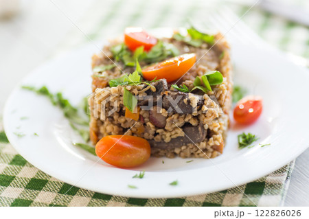 cooked dinner with bulgur and vegetables 122826026
