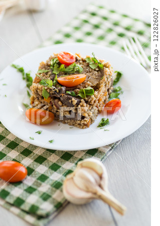 cooked dinner with bulgur and vegetables 122826027