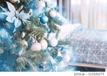 Close up of colorful ornaments on Christmas tree. Happy New Year and Christmas. Bokeh light soft effect Close up of colorful ornaments on Christmas tree. Happy New Year and Christmas. Bokeh light soft effect 122826275